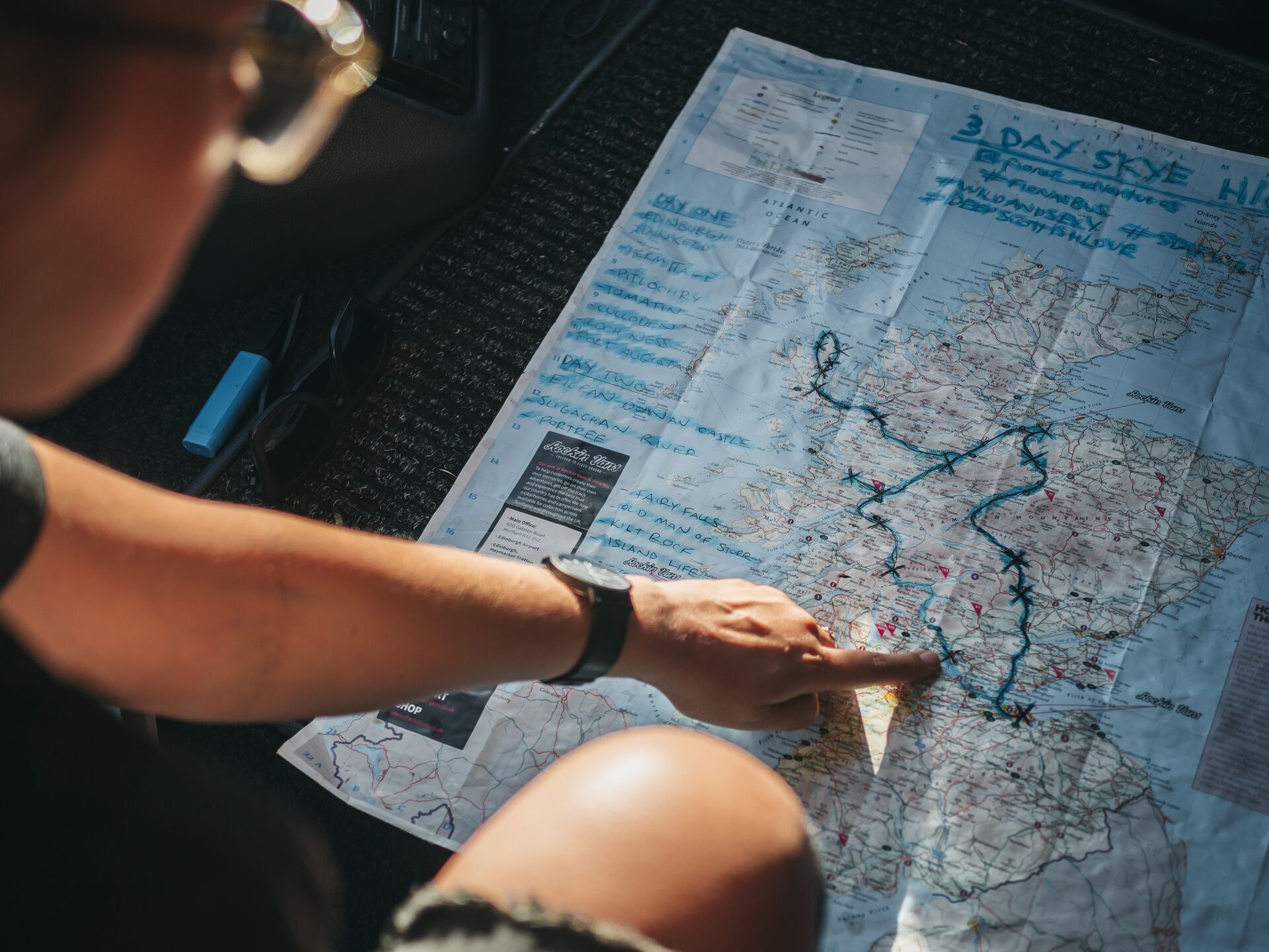 Traveller pointing on map