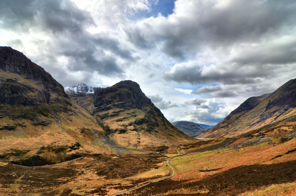 Aerial view of Glen Coe valley with snow-capped mountains