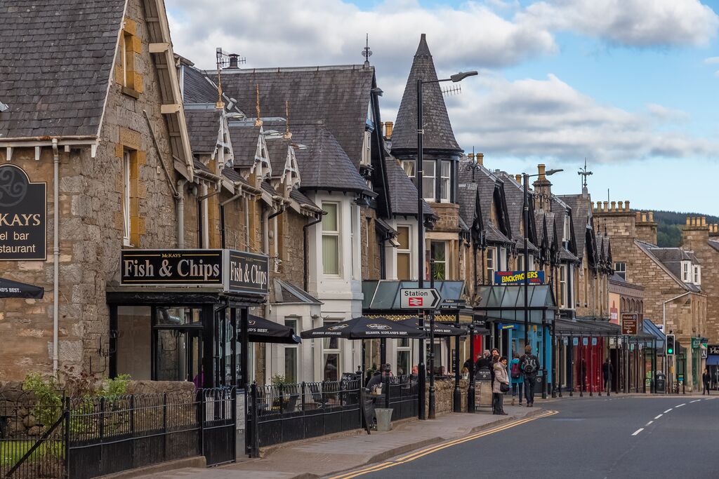 Victorian stone houses on shopping and cafe street in Pitlochry village